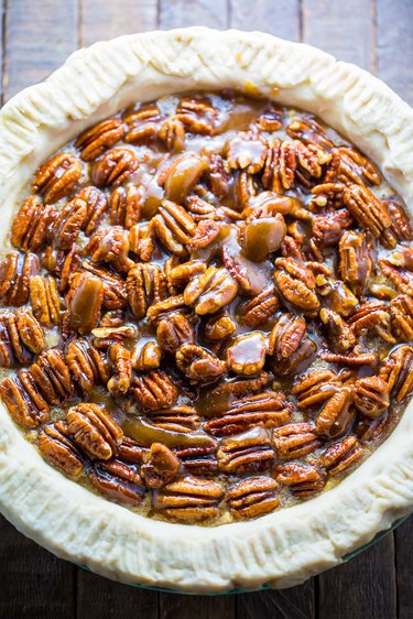 Spoon pecan halves on top of the pie and bake for 75 minutes
