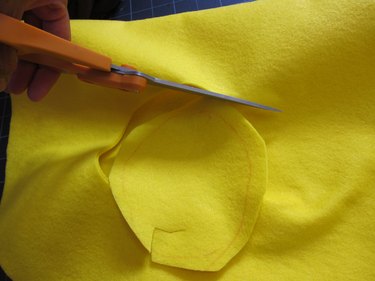 Cut holes out for arms