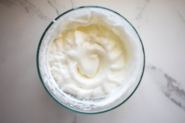 Whisk the whites until they form firm peaks.