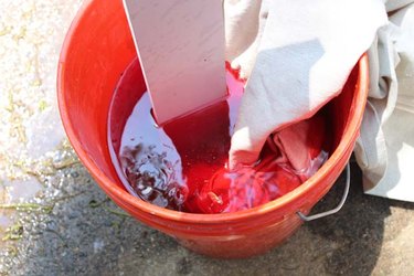 Place curtains in dye bucket.