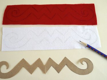 The traced template on red and white felt.