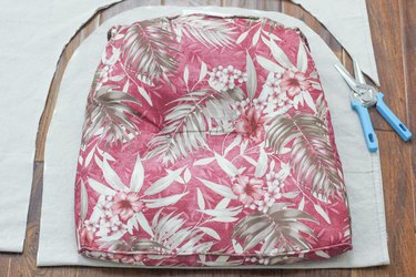 Cutting fabric out around the cushion