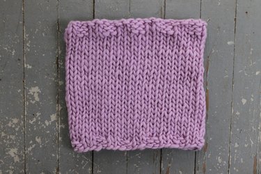 Finished knit cowl in stockinette stitch.
