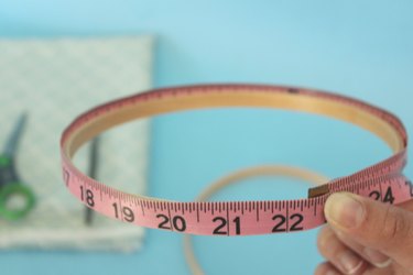 Measure the embroidery hoop with a measuring tape.