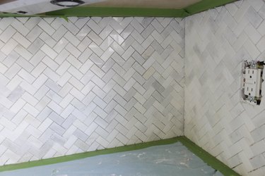 Mosaic wall tile meeting at a corner.