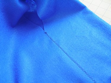 The sides of the vest sewn with a zigzag stitch.