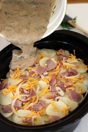 milk mixture over potatoes
