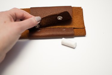 Fold the wallet and mark snaps.