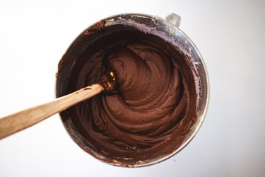 Stirring the batter with a spatula.
