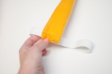 Sew the tail to the elastic.