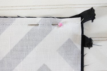 place outer fabric along long edge facing down, pin in place.