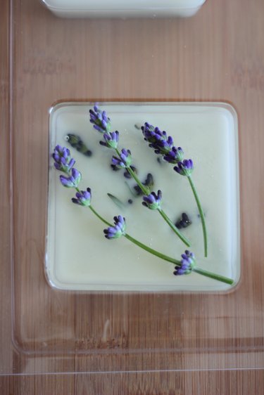 Place more flowers on top of wax if you wish.