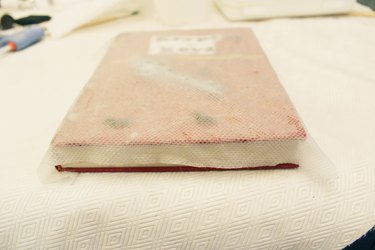 Wet paper towel over book.