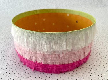 continue attaching fringed crepe paper strips in an ombre pattern