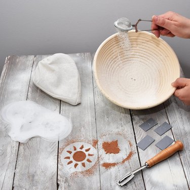 Hands using bread proofing set