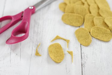 Pile of small yellow felt ovals for DIY felt succulent plant