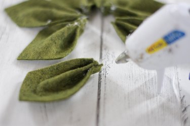 Gluing the pleated leaf shapes