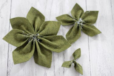 Three different sizes of star-shaped felt succulent plants