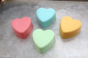 four colorful heart soaps