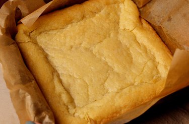 Baked sugar cookie dough in a square pan.