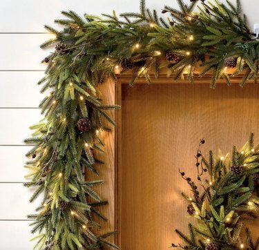 Green pre-lit garland over doorway