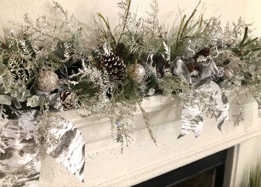 Flocked garland with pinecones and ornaments