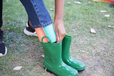 fitting the legs into the boots