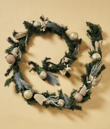 Green garland decorated with ornaments
