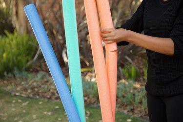 cutting the pool noodles to the right height