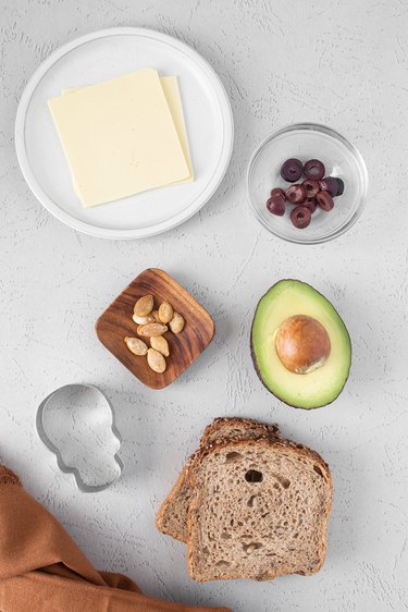 Ingredients for the skull avocado toast all laid out on a counter