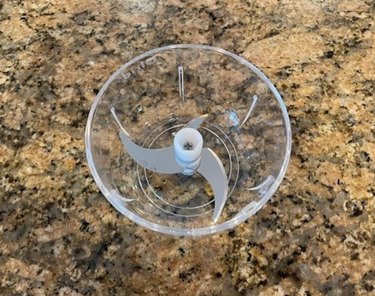 Top view of blending bowl of Olrid Cordless Food Chopper, with tri-blade.