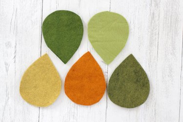 felt pieces cut into leaf shapes in a variety of colors