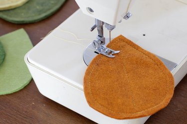 stitching leaf vein pattern onto felt coaster