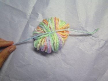 Double knotted tie around a bundle of yarn