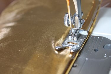 Sew a 1/4 inch seam along the two sides and bottom of the case.
