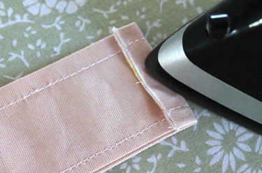 press under strap ends