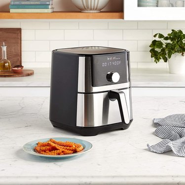 Instant Vortex Plus 6-in-1 Air Fryer Oven (4 Quarts) sitting on nice kitchen countertop.