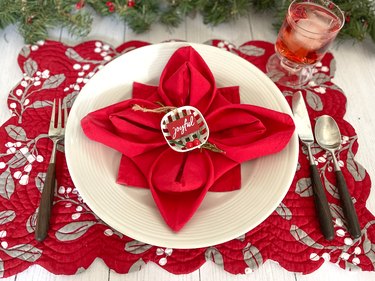 Place setting with poinsettia napkin