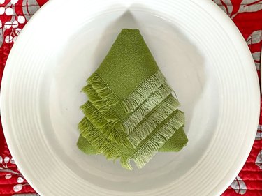 carefully turn over the folded napkin