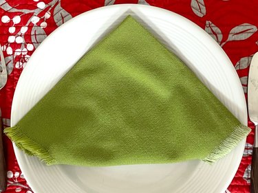 carefully turn over the folded napkin