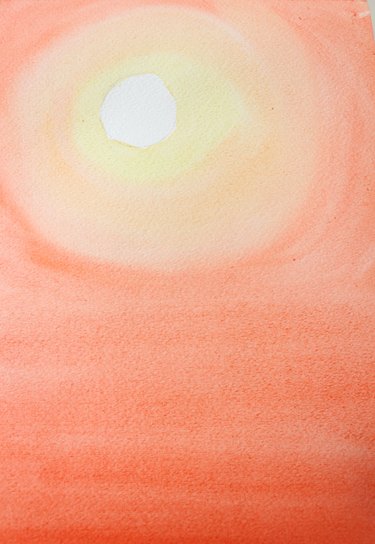 Paint bottom of paper a darker orange.