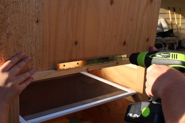 Attaching the front with a hinge.