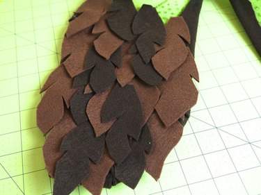 Bottom half of wing covered in brown felt feathers.