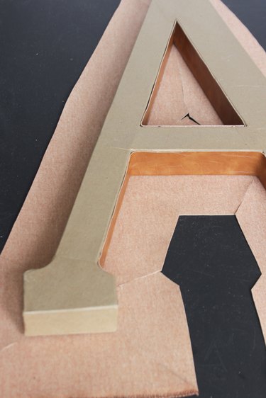 Letter "A" placed back on top of fabric that will cover front and sides.