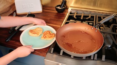 two heart-shaped slices of stuffed French toast