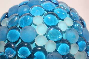 Blue glass beads on garden globe