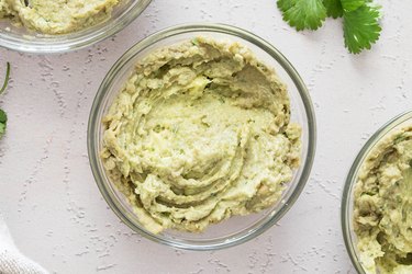 Divide guacamole hummus into bowls