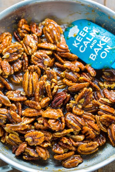 Make the topping by combining melted butter, brown sugar, and pecan halves
