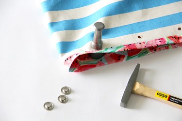 Use a mallet to hammer in grommets