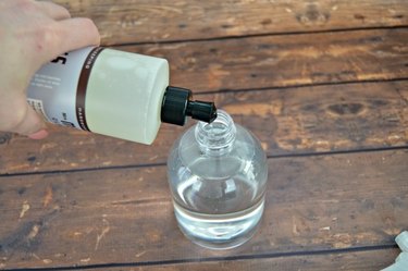 Add dish liquid to the spray bottle.